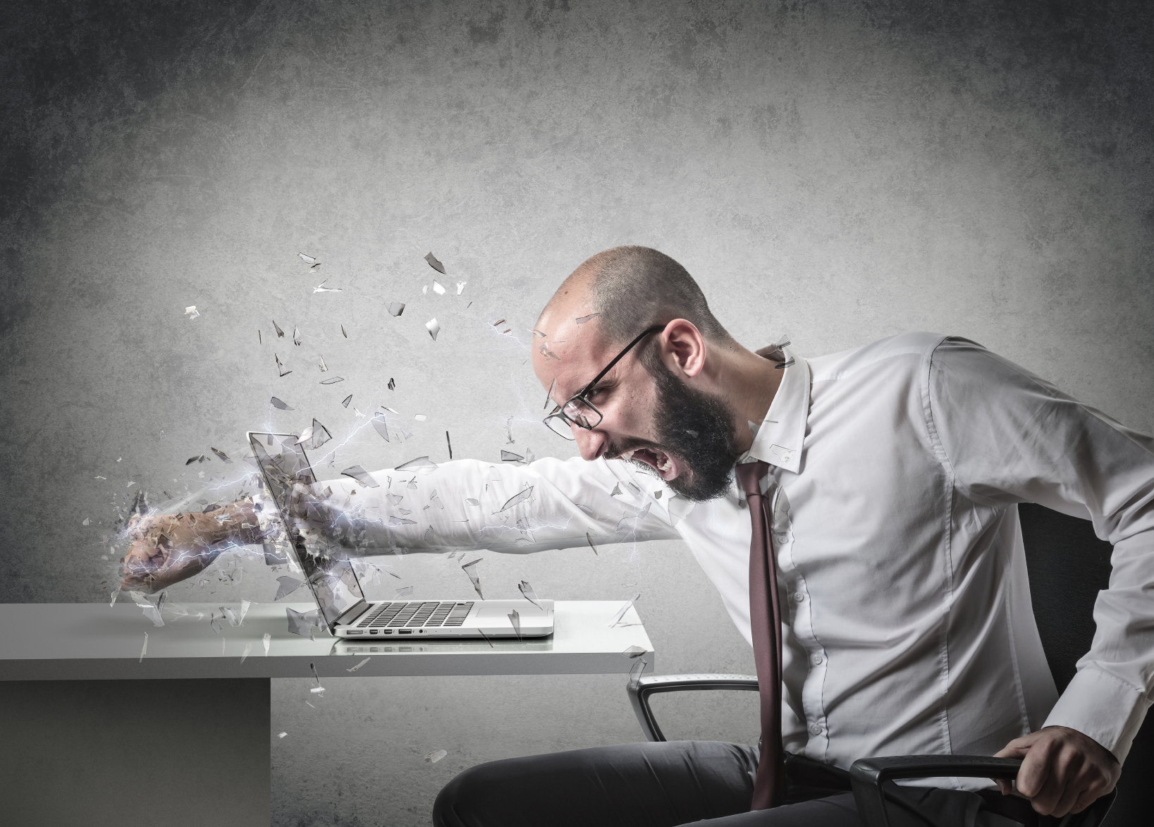 Man Punching Laptop