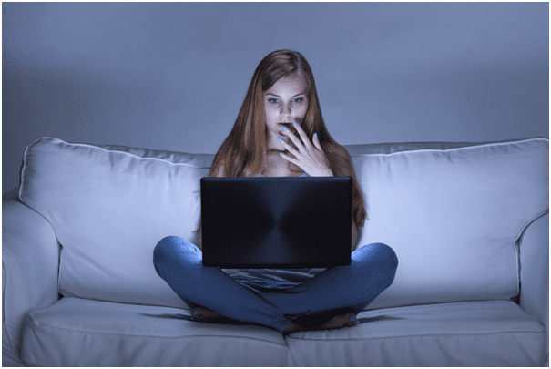 Woman on Sofa Using Laptop