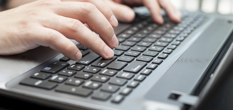 Fingers Using Laptop Keyboard